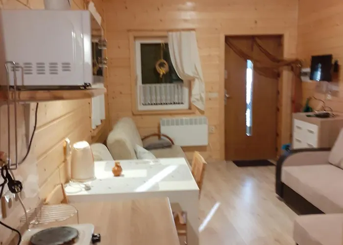 Деревянный коттедж Nad Jeziorem/seehaus 1b